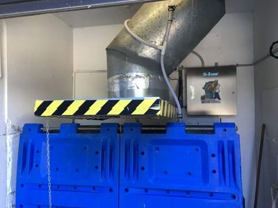 Garbage Doctor 3000 beside an angled chute over blue recycling bins