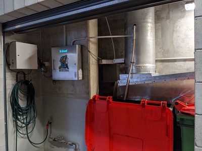 Garbage Doctor Scenting beside a Si-Zone ozone unit, over a rubbish bin with a red lid