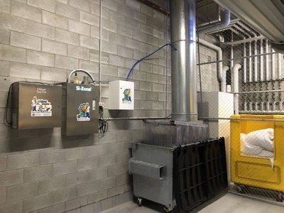 Garbage Doctor Scenting with an Odour Doctor and a Si-Zone ozone unit, beside a refuse chute