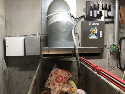 Garbage Doctor Scenting beside a Si-Zone ozone unit, over a galvanised rubbish bin under the chute