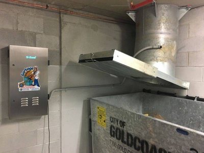 A Garbage Doctor 4000 beside a garbage chute over a large bin