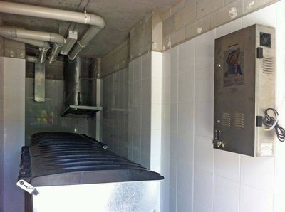 A Garbage Doctor Platinum beside a garbage chute